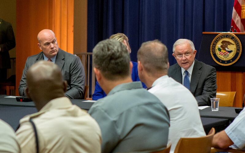 FILE PHOTO: Chief of Staff to the Attorney General Matthew Whitaker (L) looks over at U.S. Attorney General Jeff Sessions during a roundtable discussion with foreign liaison officers at the Justice Department in Washington, U.S., August 29, 2018. REUTERS/Allison Shelley/File Photo