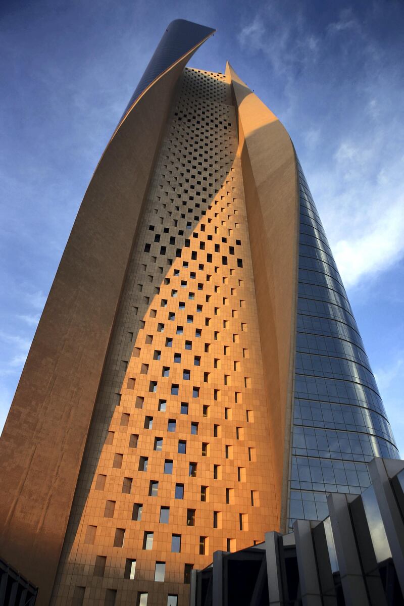 A picture taken on December 19, 2014 shows a view of al-Hamra Tower in Kuwait City. The tower is the tallest skyscraper in Kuwait and one of the top 10 tallest towers in the world. The tower is 450 metre-high and has 77 floors and 100,000 square meters of commercial and office space, as well as movie theatres, a rooftop restaurant and a spa.   AFP PHOTO / YASSER AL-ZAYYAT (Photo by YASSER AL-ZAYYAT / AFP)