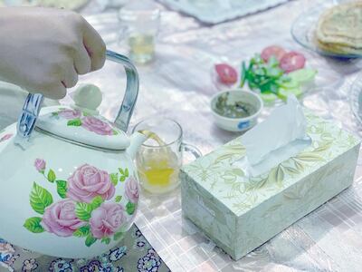 Drinking tea after the iftar, Baqir his wife Momina and their six children talked about their concerns for the future. Hikmat Noori for The National 