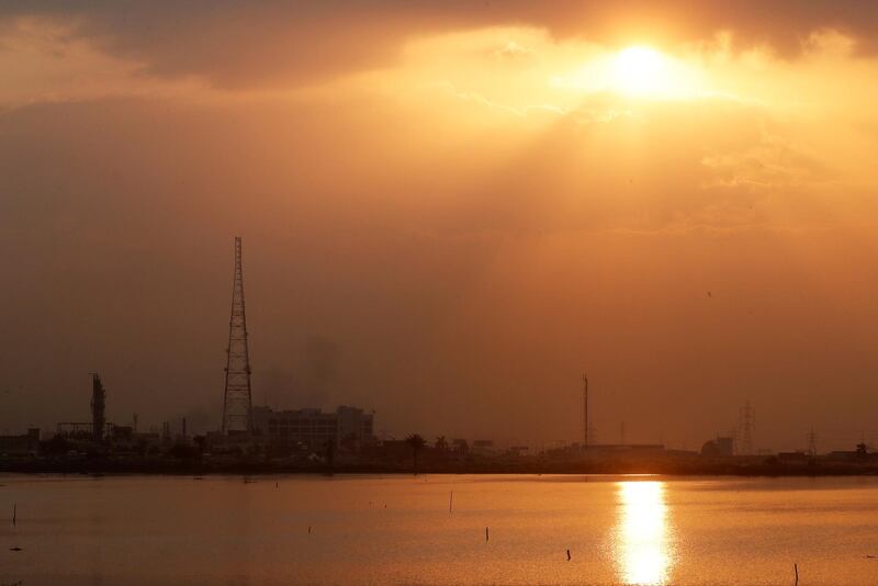 Factories of cement and petroleum by a salt lake at sunset near the port the Mediterranean city of Alexandria, north of Cairo, Egypt. Reuters