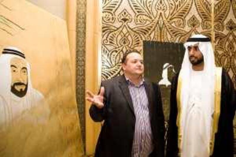 Abu Dhabi - March 17, 2010:  Pascal Salino and Mohammed bin Nayan al Nayan (in black robe but please confirm name) at a tribute exhibition of paintings by Pascal Salino at Emirates Palace. Lauren Lancaster / The National