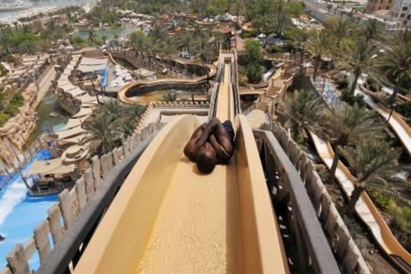 A visitor slides down the "Jumeirah Sceirah" in Dubai's Wild Wadi Oasis-themed waterpark May 5, 2008. The Jumeirah Sceirah is one of the tallest and fastest free fall water slides outside of North America.  REUTERS/Jumana El Heloueh (UNITED ARAB EMIRATES)