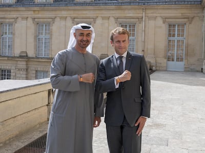 Sheikh Mohamed bin Zayed and Emmanuel Macron wear Expo 2020 Dubai wristbands at Fontainebleau Palace. Photo: Mohamed Al Hammadi / Ministry of Presidential Affairs