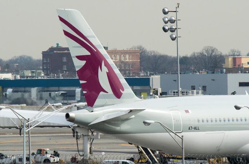 Above, a Qatar Airways aircraft is parked at John F Kennedy International Airport in New York. Passengers traveling to the US from 10 airports in eight Muslim-majority countries are barred from bringing laptops, tablets and other portable electronic devices on board with them. Don Emmert / AFP