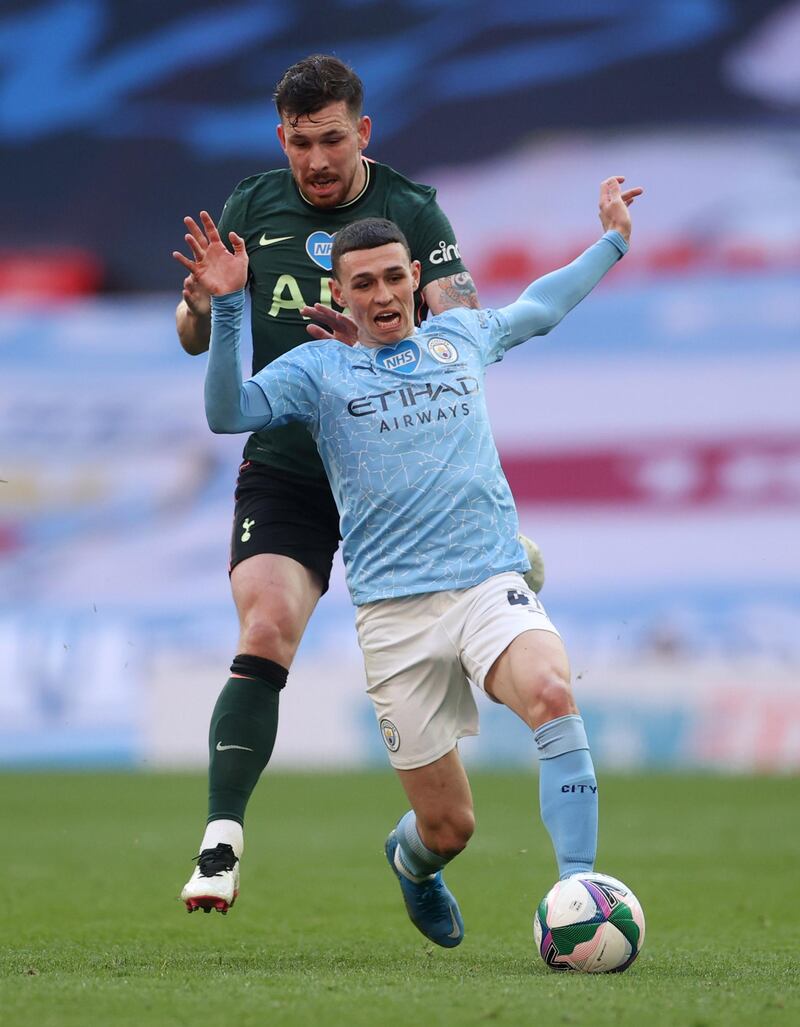 City's Phil Foden under pressure from Spurs midfielder Pierre-Emile Hojbjerg. Reuters