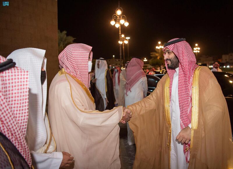 The Crown Prince (R) receives a warm welcome on arrival.