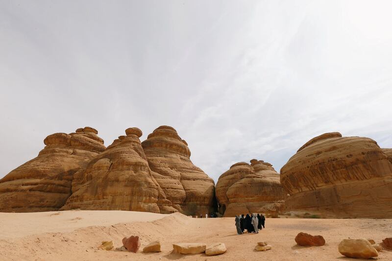Visitors tour the majestic rock-hewn tombs of Madain Saleh near the city Al Ula in Saudi Arabia. Reuters