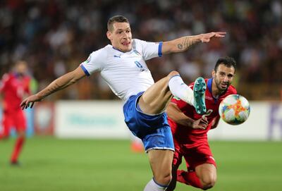 Soccer Football - Euro 2020 Qualifier - Group J - Armenia v Italy - Vazgen Sargsyan Republican Stadium, Yerevan, Armenia - September 5, 2019  Italy's Andrea Belotti in action with Armenia's Andre Calisir   REUTERS/Anton Vaganov