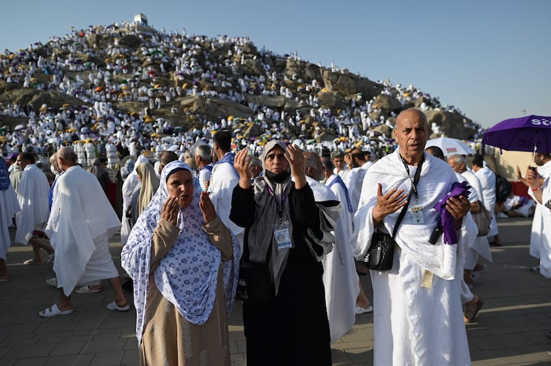 Libyan pilgrims pray at Mount Arafat. AFP
