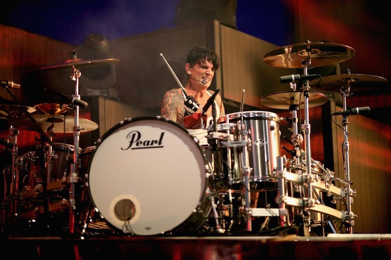 Mötley Crüe's Tommy Lee, who had a bruised bone in his wrist, says he is back to 100 per cent and will be behind the drum kit when the rockers perform in Abu Dhabi. Christopher Polk / Getty Images for iHeartMedia / AFP