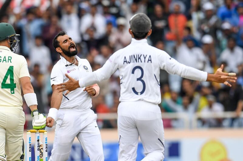 India bowler Mohammed Shami, centre, celebrates after dismissing South Africa's Dean Elgar. AFP