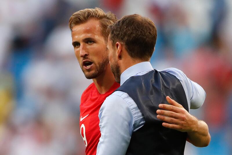 England's Harry Kane, left, and head coach Gareth Southgate celebrate their victory over Sweden during the quarterfinal match between Sweden and England at the 2018 soccer World Cup in the Samara Arena, in Samara, Russia, Saturday, July 7, 2018. (AP Photo/Frank Augstein)