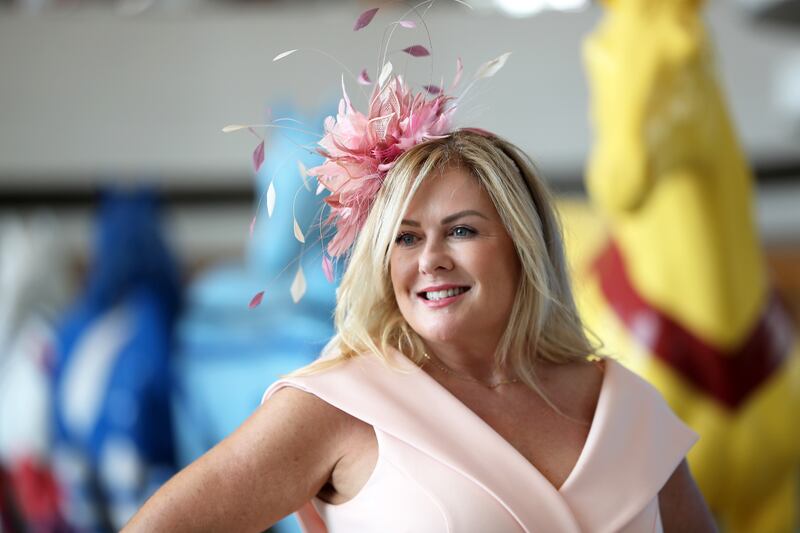 A guest wears a colourful hat before the start of Dubai World Cup held at Meydan Racecourse in Dubai. Pawan Singh / The National