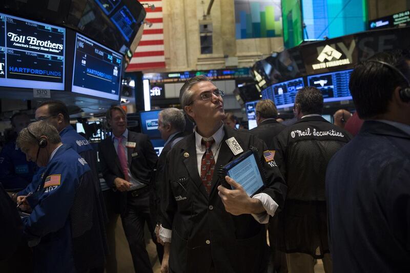The US Federal Reserve has flooded financial markets with cheap cash since 2009 with its quantitative easing programme. Above, traders on the floor of the New York Stock Exchange. Scott Eells / Bloomberg News