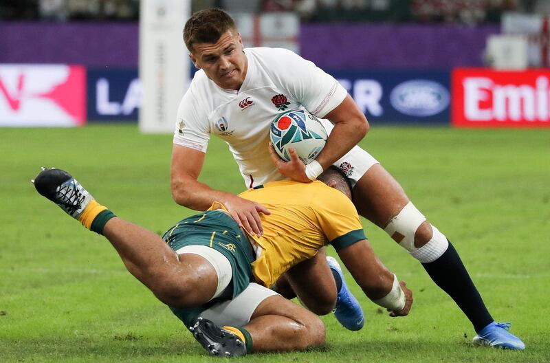 Henry Slade (top) of England in action against Tolu Latu (bottom) of Australia during the Rugby World Cup quarter-final match between England and Australia, in Oita, Japan.  EPA
