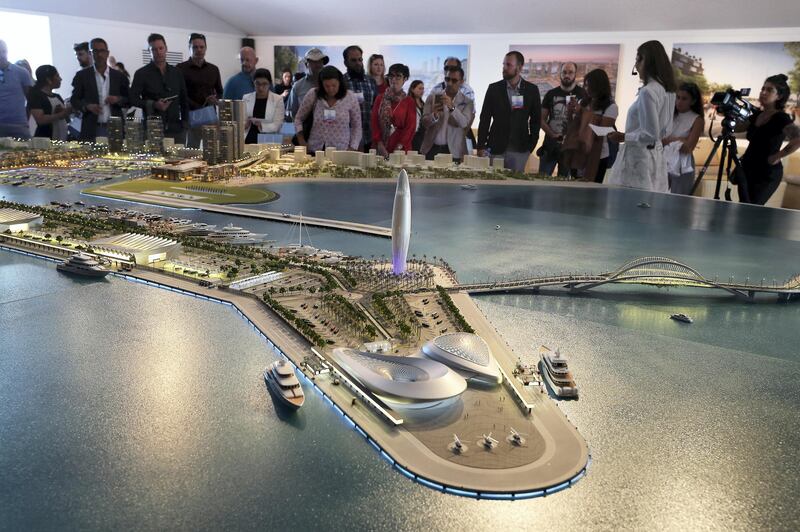 DUBAI , UNITED ARAB EMIRATES , February 26 – 2019 :- Media looking at the model of Dubai Harbour at the Dubai International Boat Show held in Dubai. ( Pawan Singh / The National ) For News/Instagram/Big Picture. Story by Nick Webster 