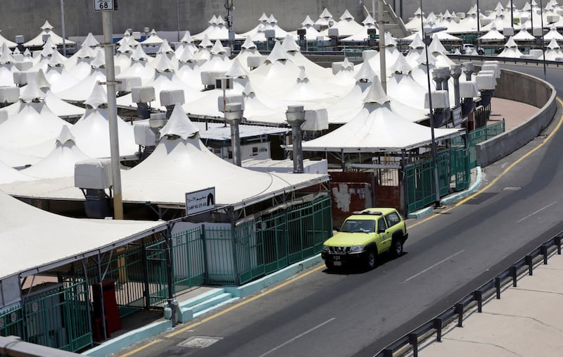 A police vehicle patrols the tented camp in Mina before the Hajj pilgrimage, which is due to start on Saturday and run until July 22 but for limited numbers.