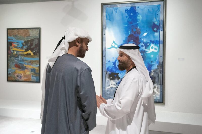 ABU DHABI, UNITED ARAB EMIRATES - December 05, 2018: HH Sheikh Mohamed bin Zayed Al Nahyan, Crown Prince of Abu Dhabi and Deputy Supreme Commander of the UAE Armed Forces (L), speaks with an artist while visiting the Qasr Al Hosn Festival.
( Ryan Carter / Ministry of Presidential Affairs )
---