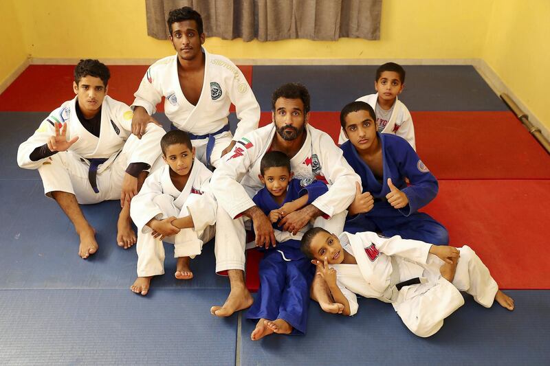 ABU DHABI, UNITED ARAB EMIRATES , April 22– 2020 :- Khaled Al Awlaqi, former Jiu Jitsu player with his seven sons Mahdi (17), Faraj (15), Mohammed (14), Altheeb (8), Mubarak (6), Abdullah (6) and Omar (5) at his home in Baniyas area in Abu Dhabi.  (Pawan Singh / The National) For Sports/Online. Story by Amith