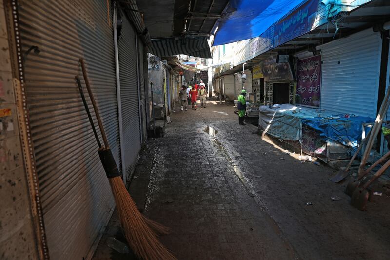 Shopkeepers and market stall-holders closed their businesses until the village can be cleared of mud. AP Photo