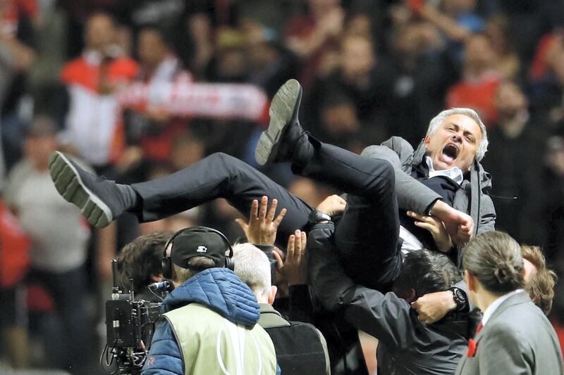 Manchester United's Portuguese manager Jose Mourinho is thrown in the air by his staff after the UEFA Europa League final football match Ajax Amsterdam v Manchester United on May 24, 2017 at the Friends Arena in Solna outside Stockholm. / AFP PHOTO / Odd ANDERSEN
