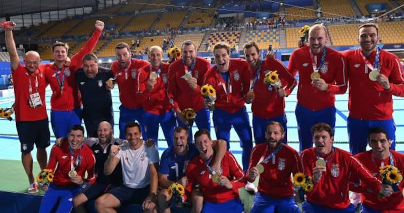 Gold medallists Serbia pose during the medal presentation ceremony after the Tokyo 2020 Olympic Games men's water polo gold medal match.