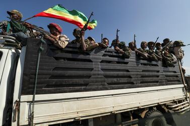 Members of Amhara region militias ride on a truck as they head to face the Tigray People's Liberation Front (TPLF), in Sanja, Amhara, Ethiopia. Reuters