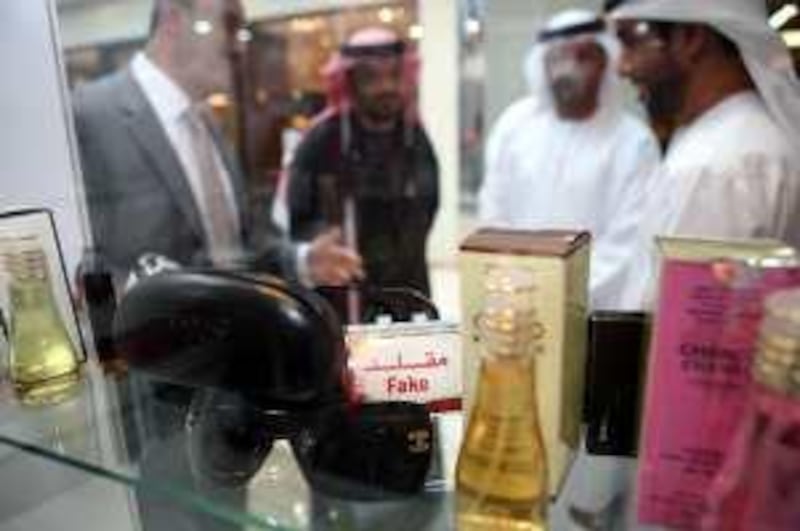Dubai, UAE - December 13, 2009 - Counterfeit eye wear and perfume on display at the Counterfeiting Exhibition Marina Mall organised by Abu Dhabi Economic Department. (Nicole Hill / The National)  *** Local Caption ***  NH Counterfeit08.jpg