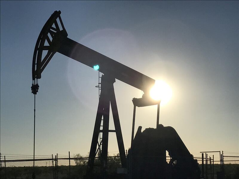 FILE PHOTO: An oil pump is seen operating in the Permian Basin near Midland, Texas, U.S. on May 3, 2017. Picture taken May 3, 2017. REUTERS/Ernest Scheyder/File Photo