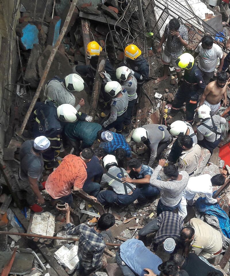 Rescue workers and residents search for survivors at the site. Reuters