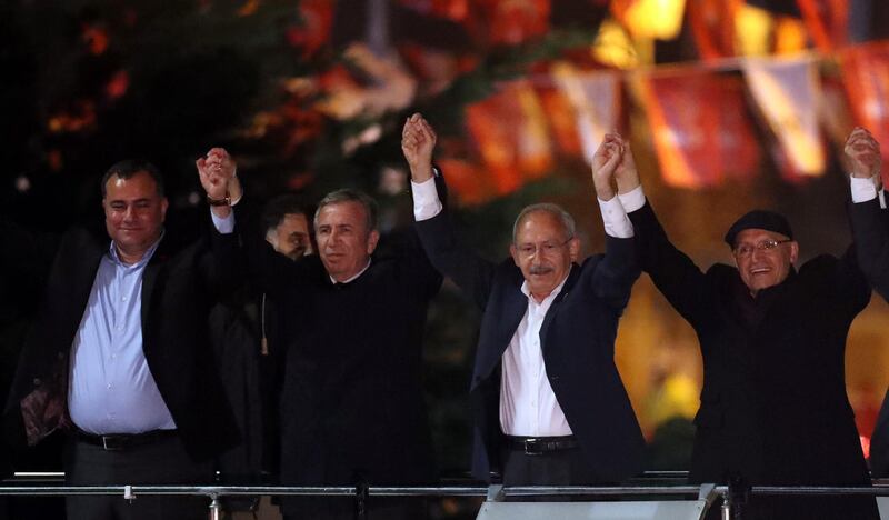 Kemal Kilicdaroglu and Mansur Yavas greet their supporters in Ankara. AFP