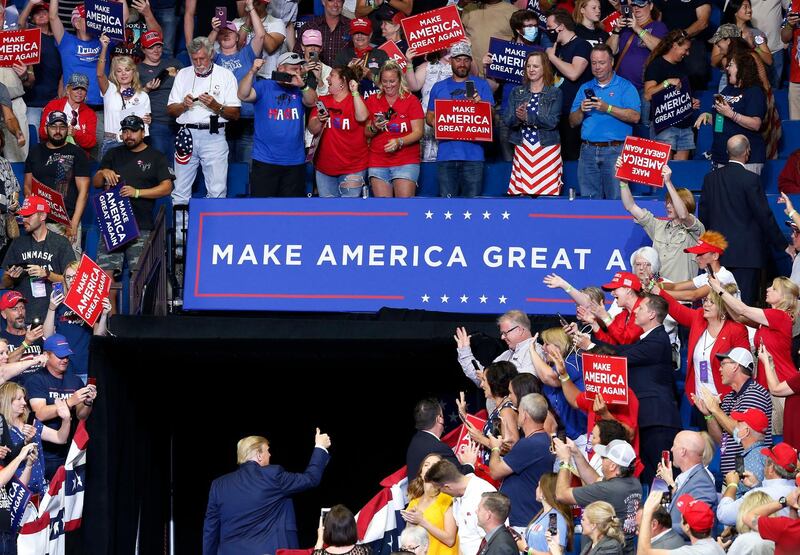 US President Donald Trump gives a thumbs-up to the crowd at the BOK Centre after his first re-election rally. Tulsa World via AP
