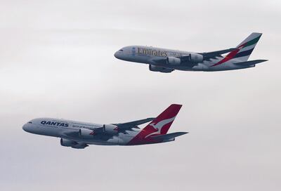 FILE PHOTO: A Qantas Airways and an Emirates Airlines Airbus A380 fly in formation during a flyover at an altitude of around 450m (1500 ft) above Sydney March 31, 2013.   REUTERS/Daniel Munoz/File Photo