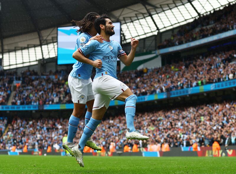 Manchester City's Ilkay Gundogan celebrates scoring their first goal with Nathan Ake in the 2-1 Premier League victory against Leeds United at the Etihad Stadium on May 6, 2023. Reuters