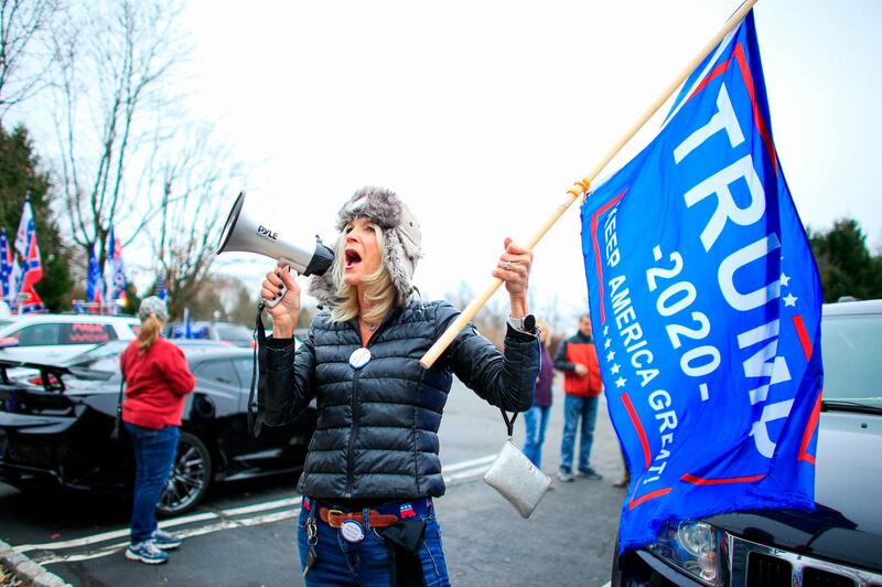 A woman shouts slogans as Trump Supporters gather during a car rally named as “Stop the Steal” in Long Valley, New Jersey.  AFP