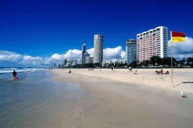 This 2001 photo released by Tourism Australia, shows skyscrapers and the beach at Surfers Paradise, Queensland, Australia. They come to Surfers not only for the hopping nightlife, waves and beaches _ which can be found in a multitude of locations along Australia's coast _ but also because of the avalanche of excursion options. Day trips abound to satisfy every taste: SeaWorld and a theme park called Dreamworld for families, whale-watching trips for marine enthusiasts and nearby Brisbane tours for steadfast urbanites. (AP Photo/Tourism Australia)