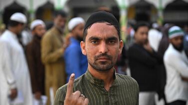 A voter shows his inked finger after casting his ballot in Kairana, in Uttar Pradesh state. . AFP