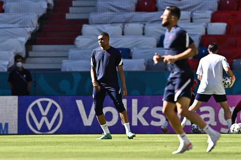 France players Kylian Mbappe and Olivier Giroud warm up during the training session in Munich ahead of the Euro 2020 Group F match against Germany. EPA
