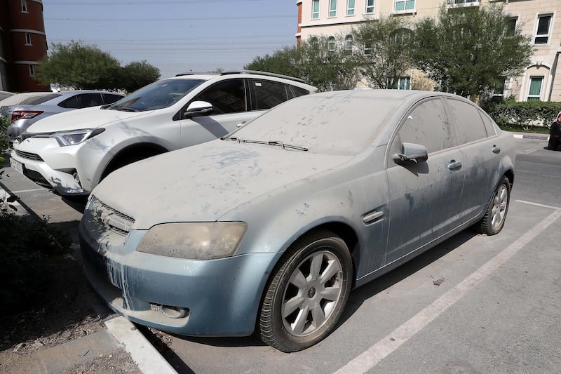 DUBAI , UNITED ARAB EMIRATES , SEP 19  ��� 2017 :  Dirty and abandoned car parked in the parking area of Discovery Gardens area in Dubai. ( Pawan Singh / The National ) 