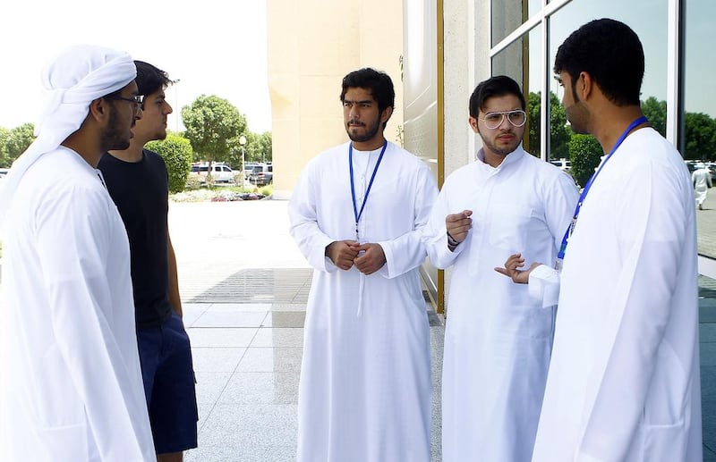 From left: Al Murr Al Marri, Ahmad Al Emadi, Mohammed Al Awadi, Khaled Jassem Sabt and Hamad Al Mansoor, talk to The National about the need for authorities to educate youngsters about UAE laws and citizens’ rights.  Jeffrey E Biteng / The National 