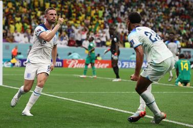 Jordan Henderson (L) of England celebrates with teammate Jude Bellingham (R) after scoring the 1-0 during the FIFA World Cup 2022 round of 16 soccer match between England and Senegal at Al Bayt Stadium in Al Khor, Qatar, 04 December 2022.   EPA / Tolga Bozoglu