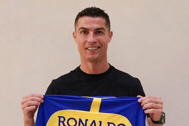 A handout picture released by Saudi Arabia's Al Nassr football club on their Twitter account shows Portugal's forward Cristiano Ronaldo posing with the club's number seven jersey in Madrid on December 30, 2022 upon signing for the Saudi Arabian club.  - Ronaldo signed for Al Nassr of Saudi Arabia, the club announced, in a deal believed to be worth more than 200 million euros.  The 37-year-old penned a contract which will take him to June 2025.  (Photo by Al Nassr Football Club  /  AFP)  /  == RESTRICTED TO EDITORIAL USE - MANDATORY CREDIT "AFP PHOTO  /  HO  / AL NASSR FOOTBALL CLUB" - NO MARKETING NO ADVERTISING CAMPAIGNS - DISTRIBUTED AS A SERVICE TO CLIENTS ==