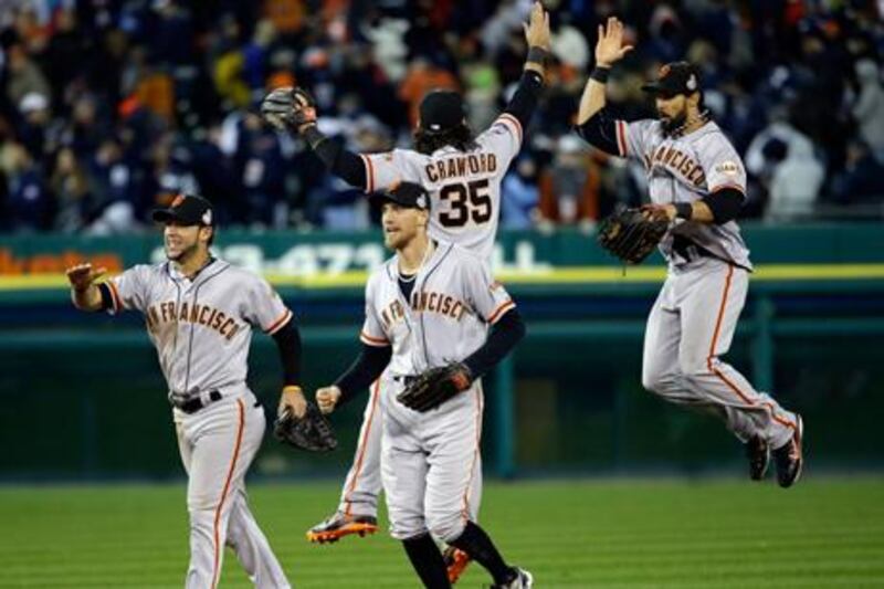 San Francisco Giants players celebrate after victory in the third game of the 2012 World Series