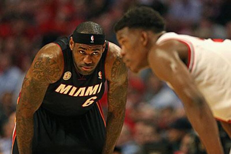 LeBron James, left, is keeping the heat on the Chicago Bulls. Jonathan Daniel / Getty Images / AFP