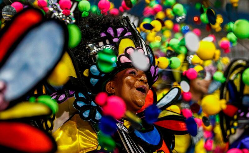 A reveller of "Academicos do Tucuruvi" samba school performs during the first night of carnival in Sao Paulo's Sambadrome, Brazil. AFP