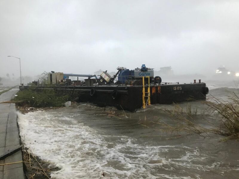 A Skanska company barge run aground along Bayfront Parkway from winds of Hurricane Sally is seen in Pensacola, Florida. REUTERS.