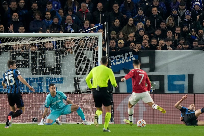 Manchester United's Cristiano Ronaldo scores his side's first goal. AP Photo