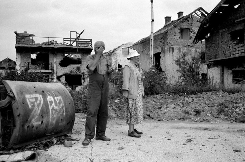 A couple survey the devastation of their neighbourhood near Sarajevo airport, where intense shelling and fighting had reduced nearly every house to rubble in April 1996. Getty Images