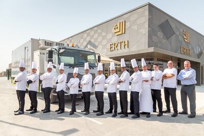 The Erth Catering team stand outside the 9,000-square-metre kitchen that can produce up to 100,000 meals a day