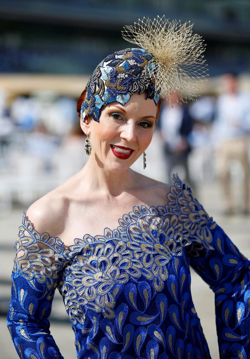 Ladies dress glamorously for the occasion, one of the richest horse races on the calendar.  EPA